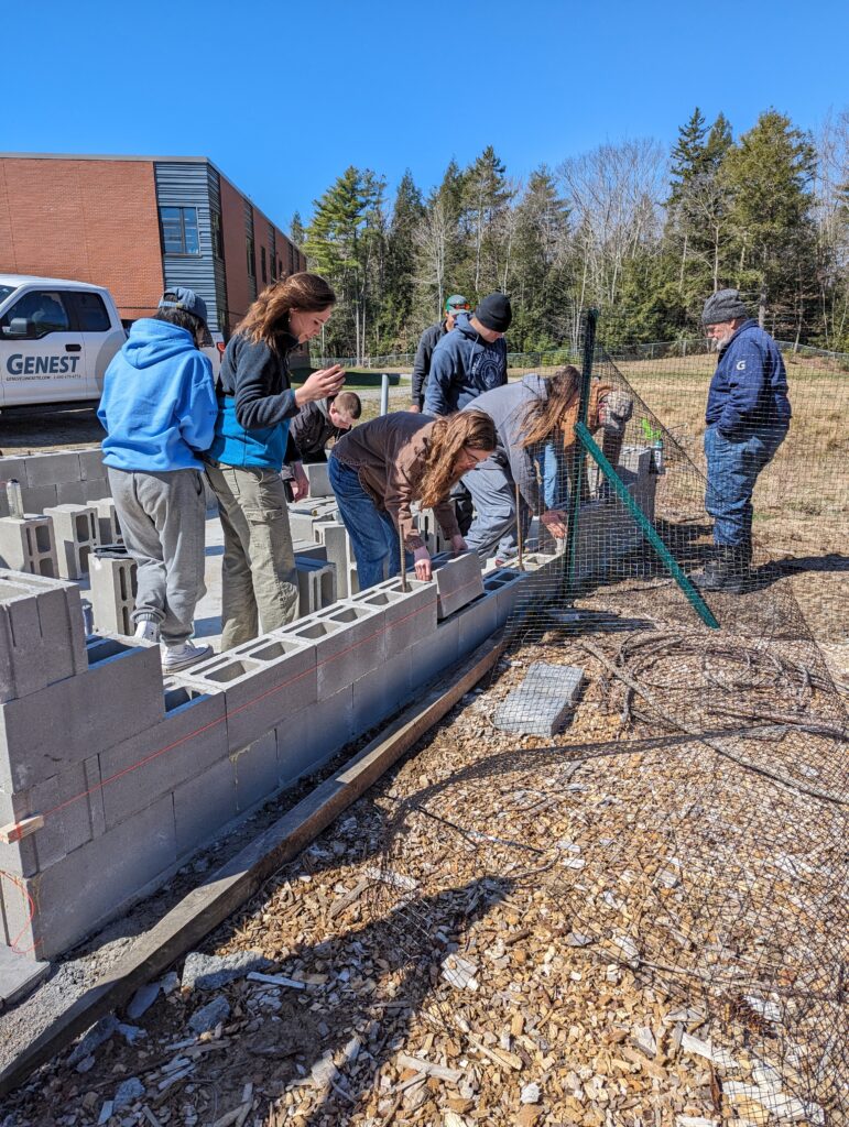 High school students build comfort block wall